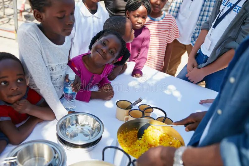 food-drive-meal-kids-outdoor-community-service-charity-volunteering-contribution-dish-help-children-lunch-422755583